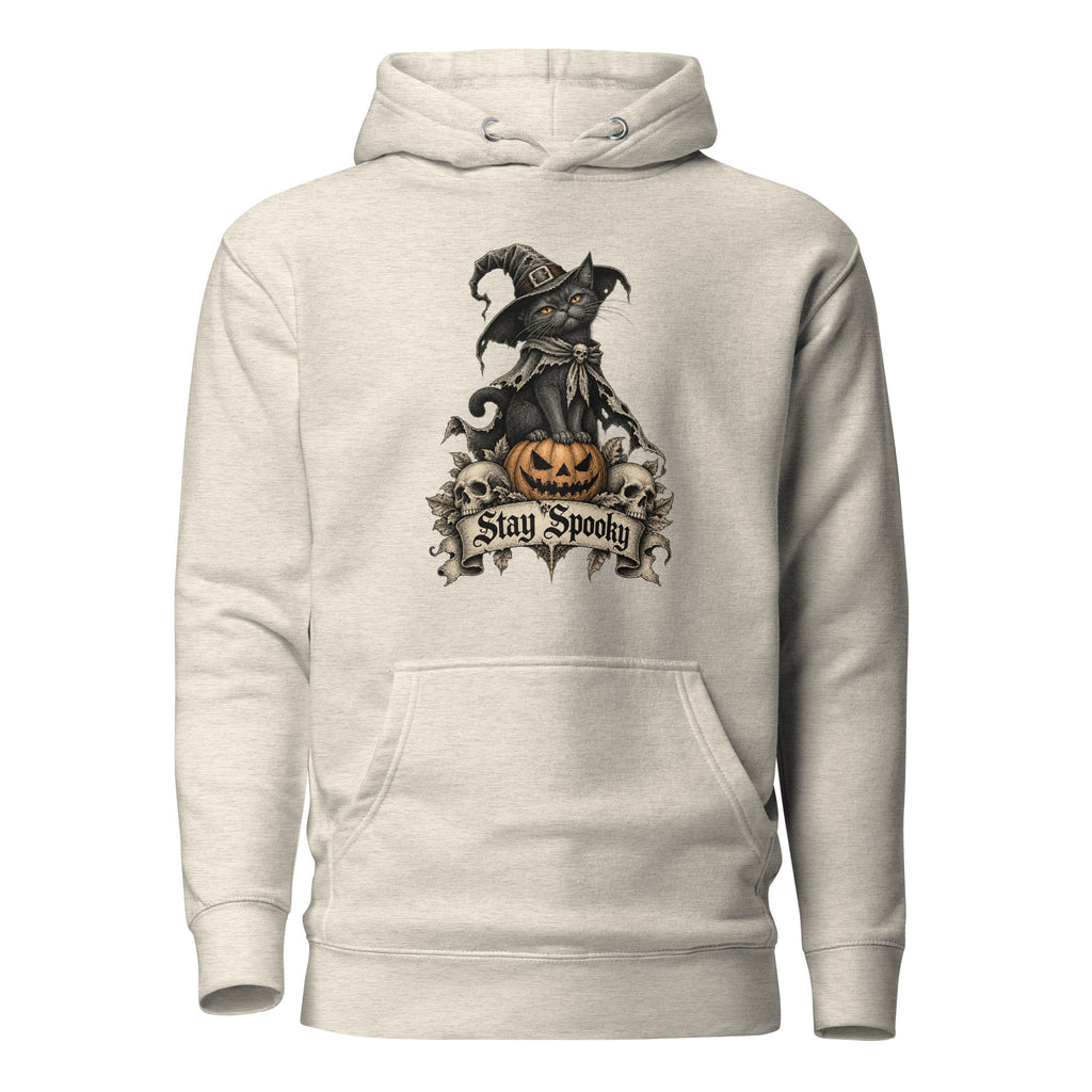 Front view of an Oatmeal Heather hoodie with a black cat in a witch hat perched on an orange pumpkin and Stay Spooky lettering.