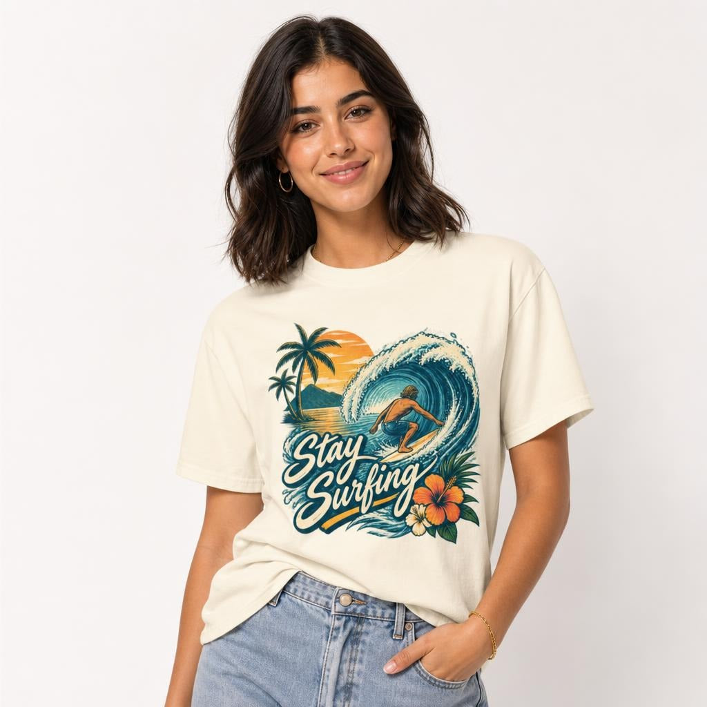 Surfer Riding A Wave t shirt in Ivory worn by a studio model in an upper-body three quarter left pose on a clean white background