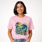 Surfer Riding Wave t shirt in Blossom worn by a studio model in an upper-body walking pose on a clean white background