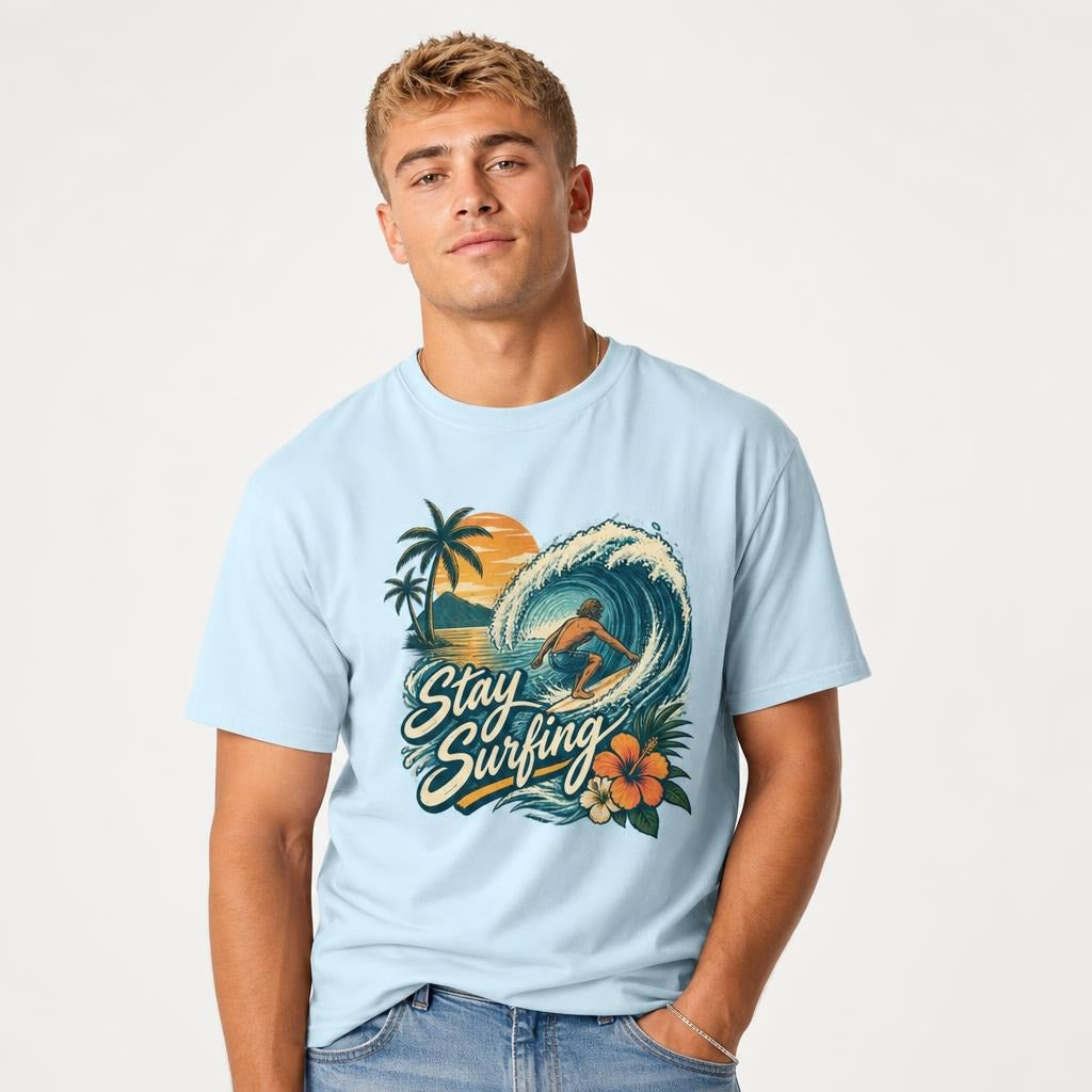Surfer Riding Wave t shirt in Chambray worn by a studio model in an upper-body three quarter right pose on a clean white background