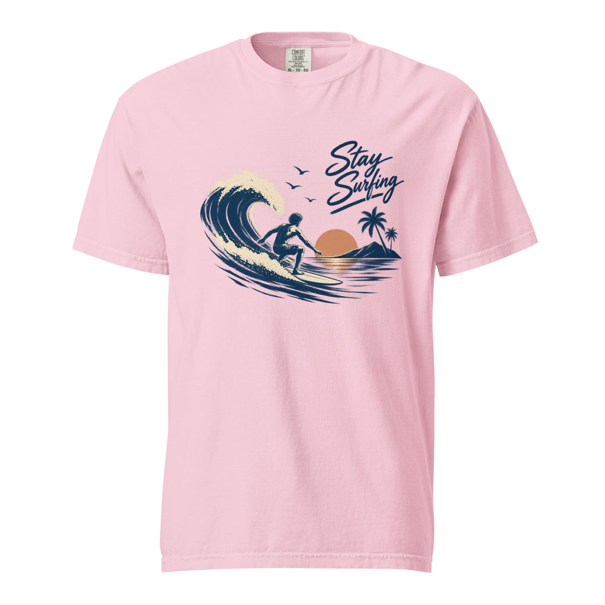 Front view of a Blossom T-shirt featuring a surfer riding a curling wave with palm trees and “Stay Surfing” script.