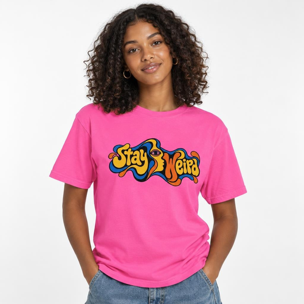 Eye t shirt in Neon Pink worn by a studio model in an upper-body hands in pockets pose on a clean white background