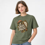 Mushroom t shirt in Moss worn by a studio model in an upper-body three quarter right pose on a clean white background