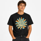 Sun t shirt in Black worn by a studio model in an upper-body hands in pockets pose on a clean white background