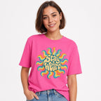 Sun t shirt in Neon Pink worn by a studio model in an upper-body walking pose on a clean white background