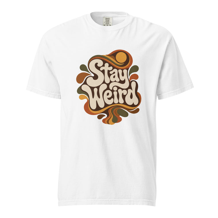 Front view of a white T-shirt with cream “Stay Weird” retro typography surrounded by flowing brown, orange, mustard and olive shapes.