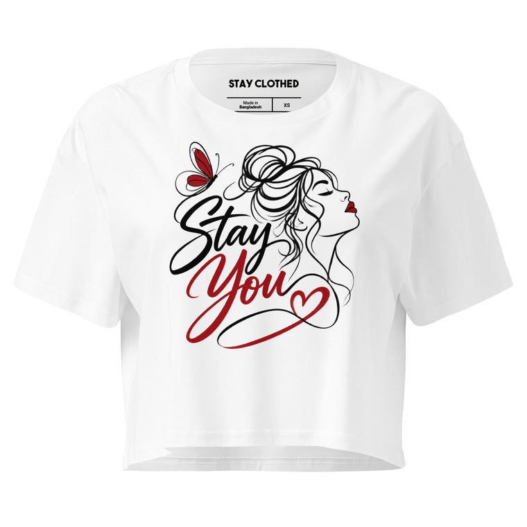 White cropped top featuring the words “Stay You” in script beside a line-art woman, butterfly, and red heart.