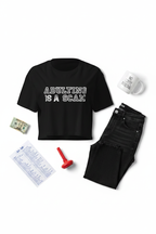 Adulting Is A Scam black crop top flat lay styled with folded jeans and stationery