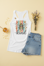 Bee Kind Racerback Tank Top flat lay styled with folded jeans and flowers