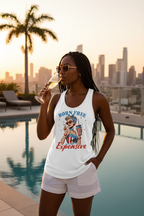 Model wearing the Born Free Expensive Racerback Tank Top in a palm tree beach scene