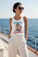 Model wearing the Born Free Expensive Racerback Tank Top with white trousers by the waterfront