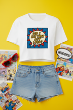 Did I Say That Out Loud Comic Crop Top flat lay styled with denim shorts on a yellow comic background