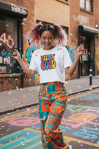 Model wearing the Feelin’ Good Colour Pop Crop Top in a colourful street scene with patterned trousers