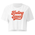 Feeling Saucy Retro Script white crop top front product mockup with bold red script lettering