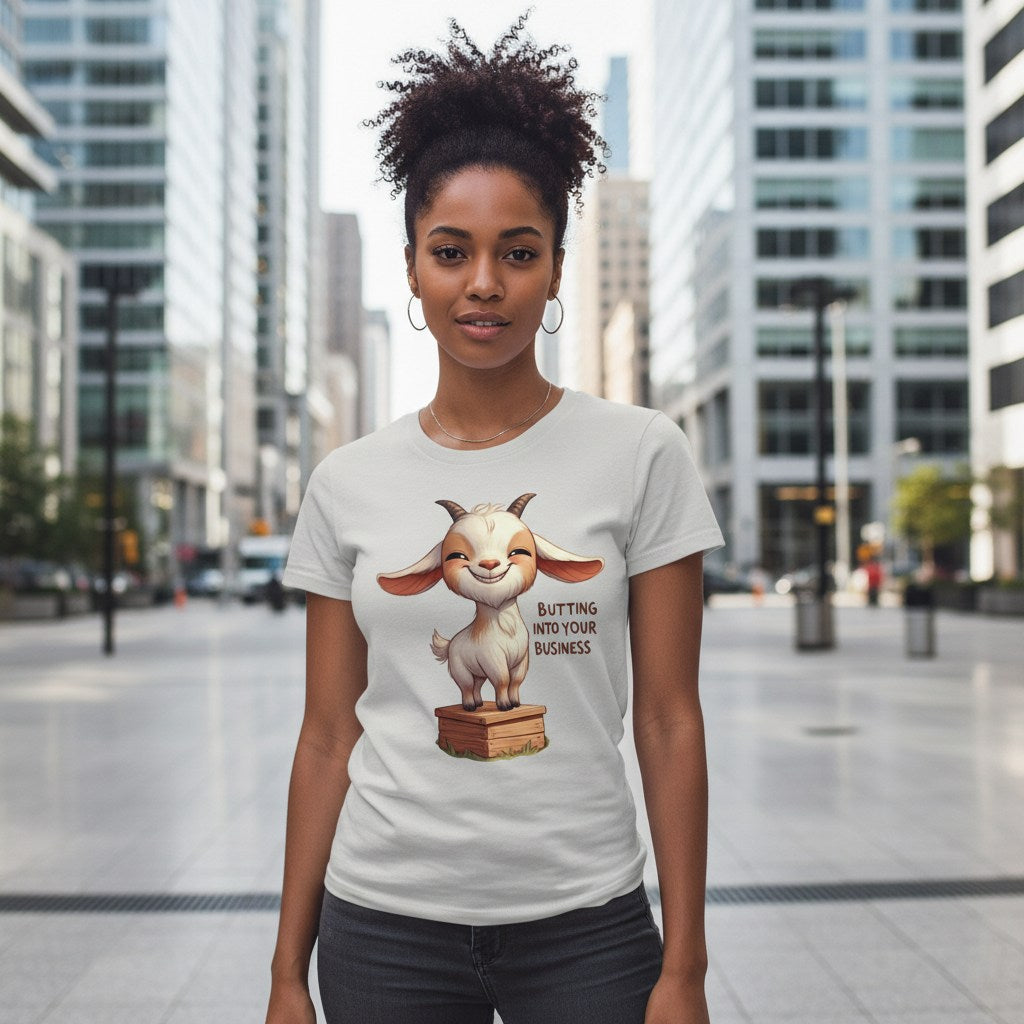Woman wearing a t-shirt with a cartoon goat graphic and text in an urban setting