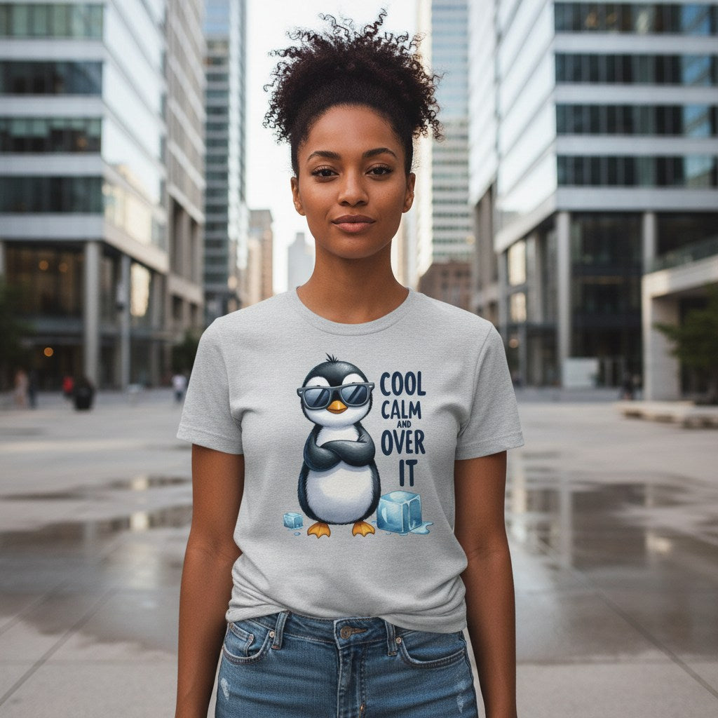 Person wearing a t-shirt with a penguin graphic and text in an urban setting
