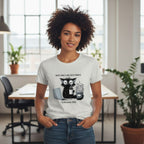 Person wearing a white t-shirt with a graphic design in an office setting