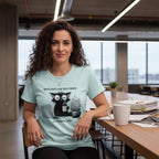 Woman wearing a light blue t-shirt with a graphic design in an office setting
