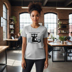 Person wearing a t-shirt with a graphic design in an office setting
