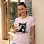 Woman wearing a pink t-shirt with a cat graphic and 'Espressivo yourself' text, holding a cup outdoors.