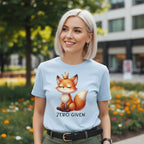 Woman wearing a light blue t-shirt with a fox graphic and 'Zero Given' text in an outdoor setting.