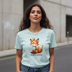 Woman wearing a light blue t-shirt with a fox graphic and 'ZERO GIVEN' text on a street.