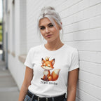 Woman wearing a white t-shirt with a fox graphic and 'ZERO GIVEN' text against a white wall.