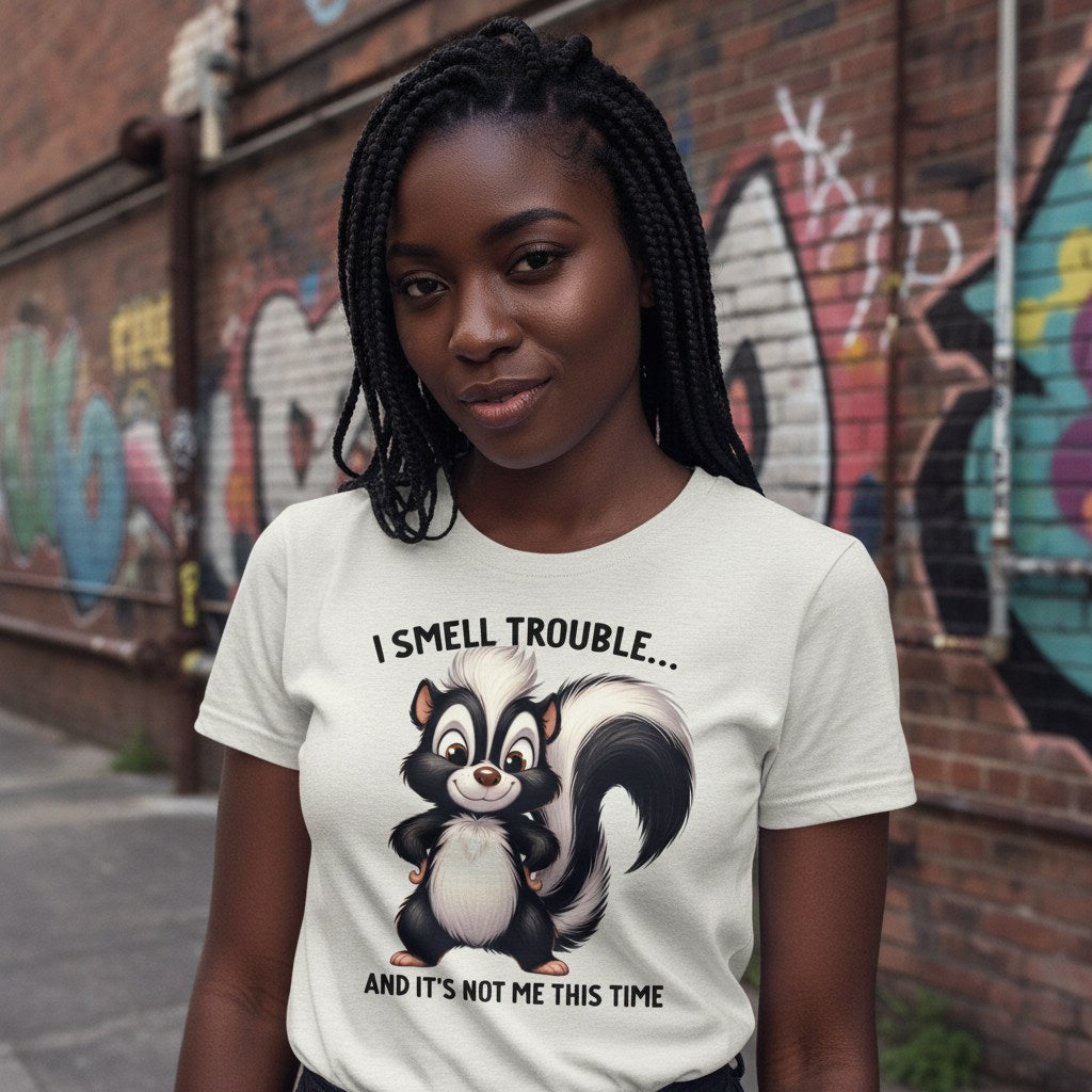 Person wearing a t-shirt with a skunk graphic and text in an urban setting
