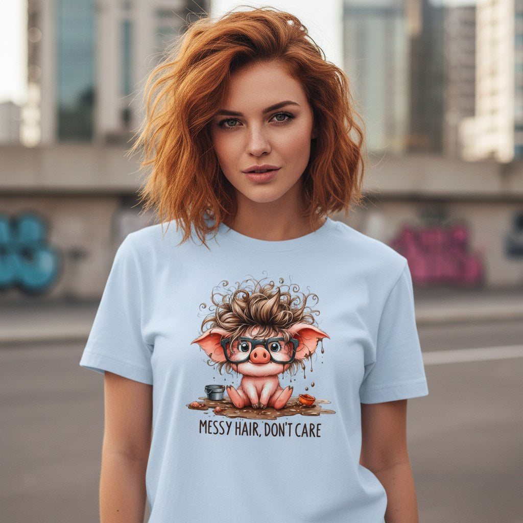 Woman wearing a light blue t-shirt with a cartoon pig design and text 'Messy Hair, Don't Care' in an urban setting.