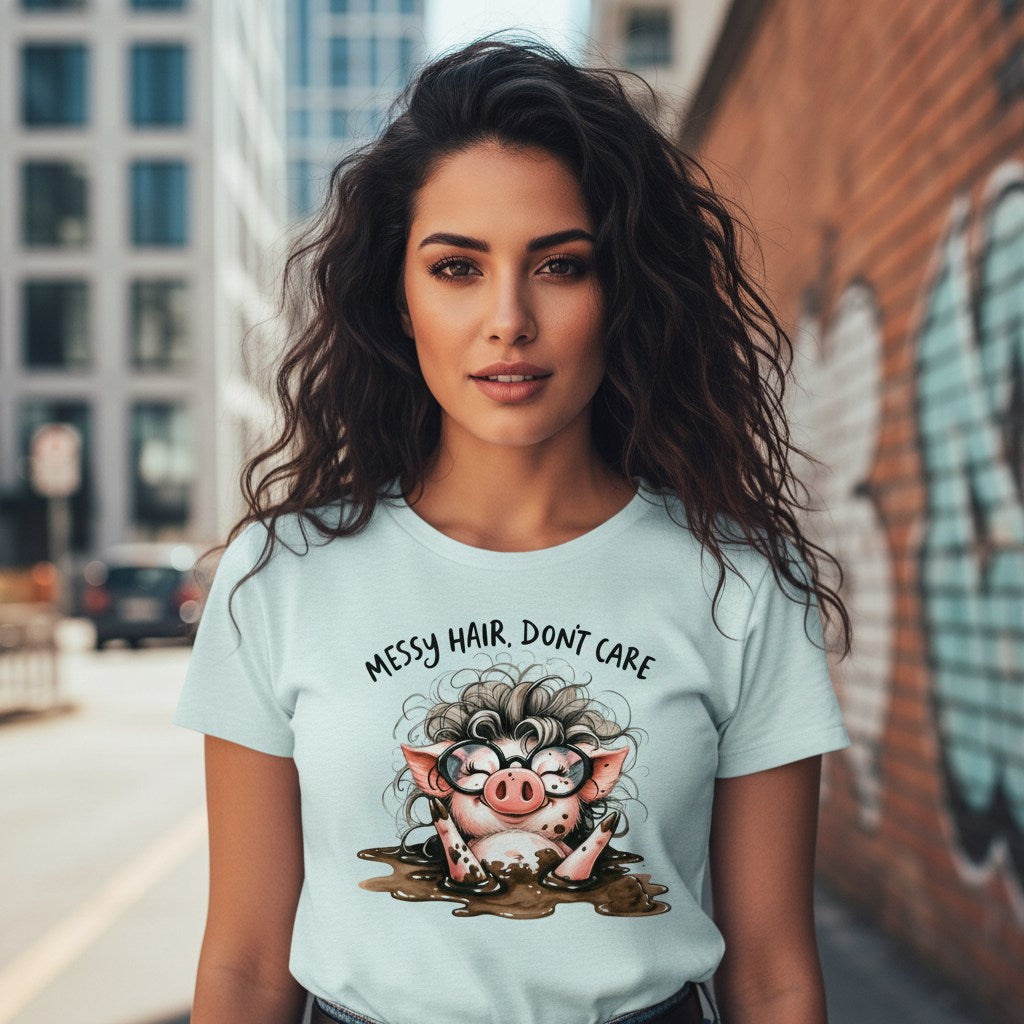 Woman wearing a light blue t-shirt with a cartoon pig design and text in an urban setting.