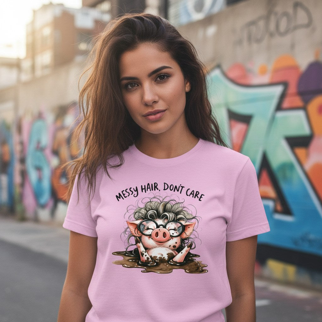 Woman wearing a pink t-shirt with a cartoon pig design and text in an urban setting with graffiti.