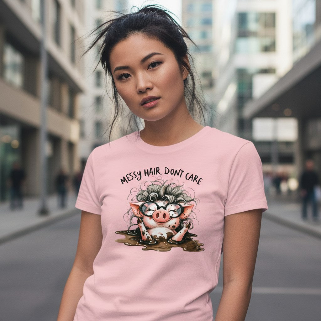 Woman wearing a pink t-shirt with a cartoon pig design and text in an urban setting