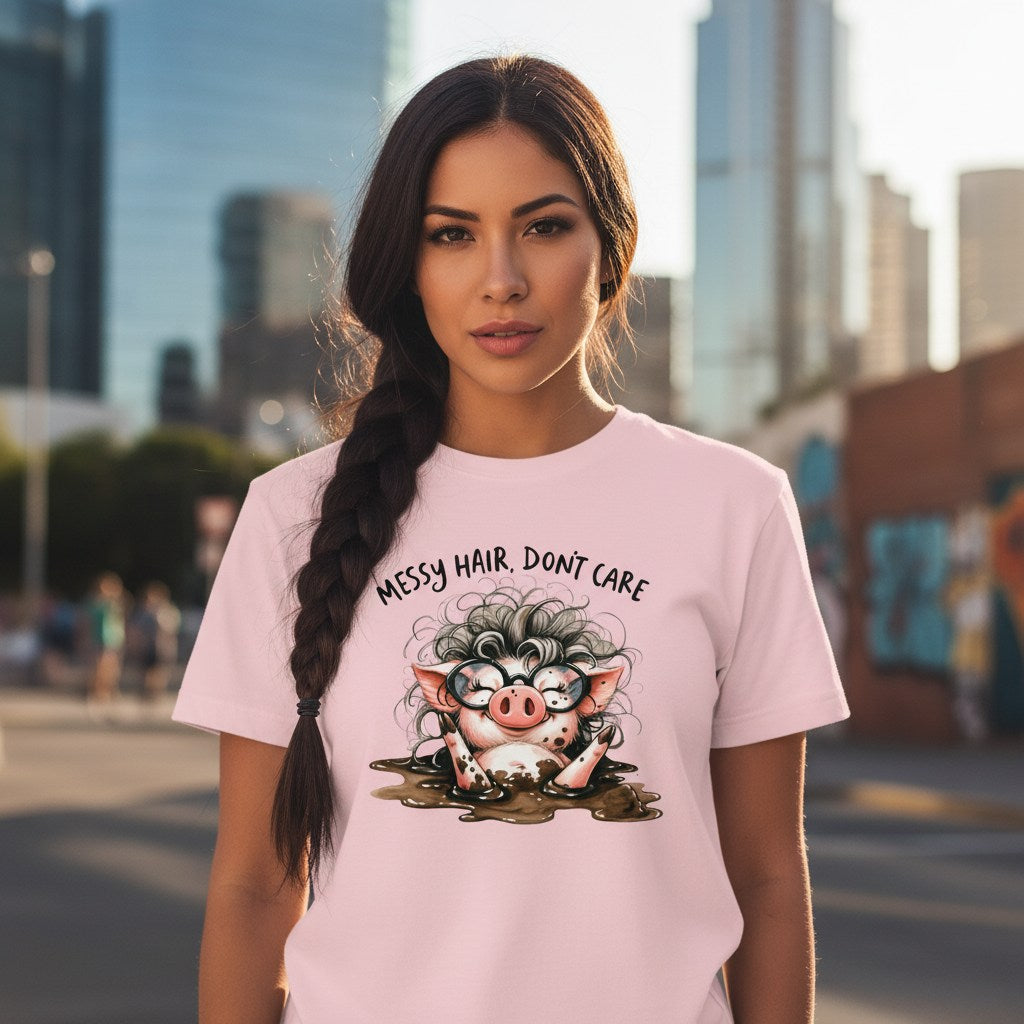 Woman wearing a pink t-shirt with a cartoon pig design and text in an urban setting