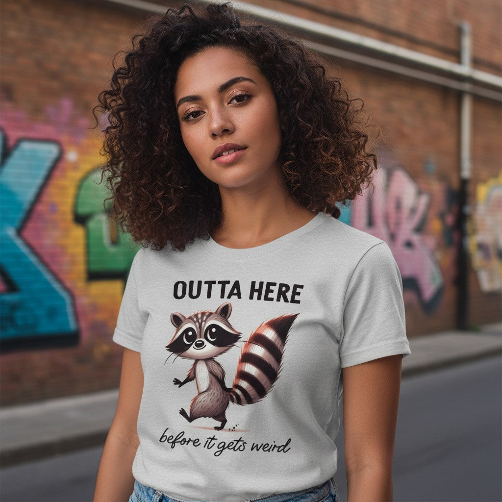 Woman wearing a t-shirt with a raccoon graphic and text in an urban setting