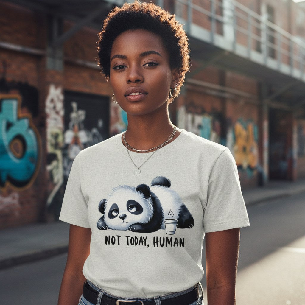 Person wearing a t-shirt with a panda graphic and text in an urban setting