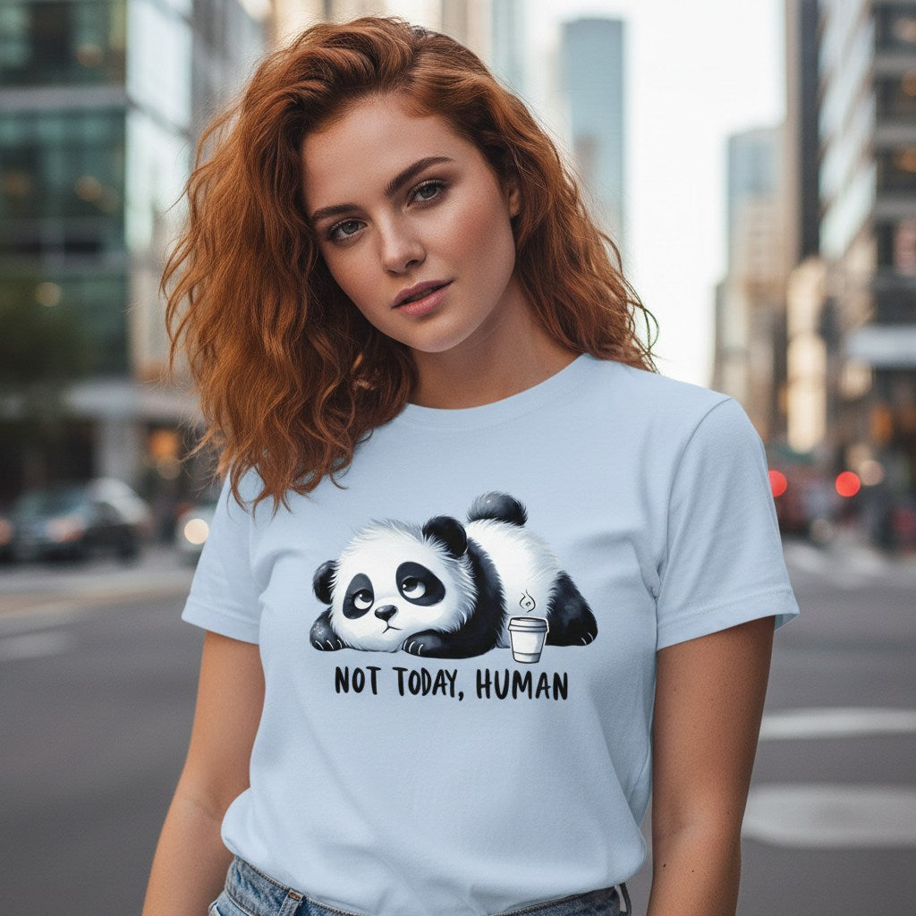 Woman wearing a light blue t-shirt with a panda graphic and text in an urban setting