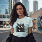 Woman wearing a light blue t-shirt with a black creature graphic and 'Decaffeinated' text, standing in an urban setting.
