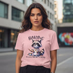 Woman wearing a pink t-shirt with a raccoon graphic and text in an urban setting