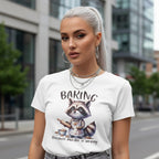 Woman wearing a white t-shirt with a raccoon graphic and text in an urban setting