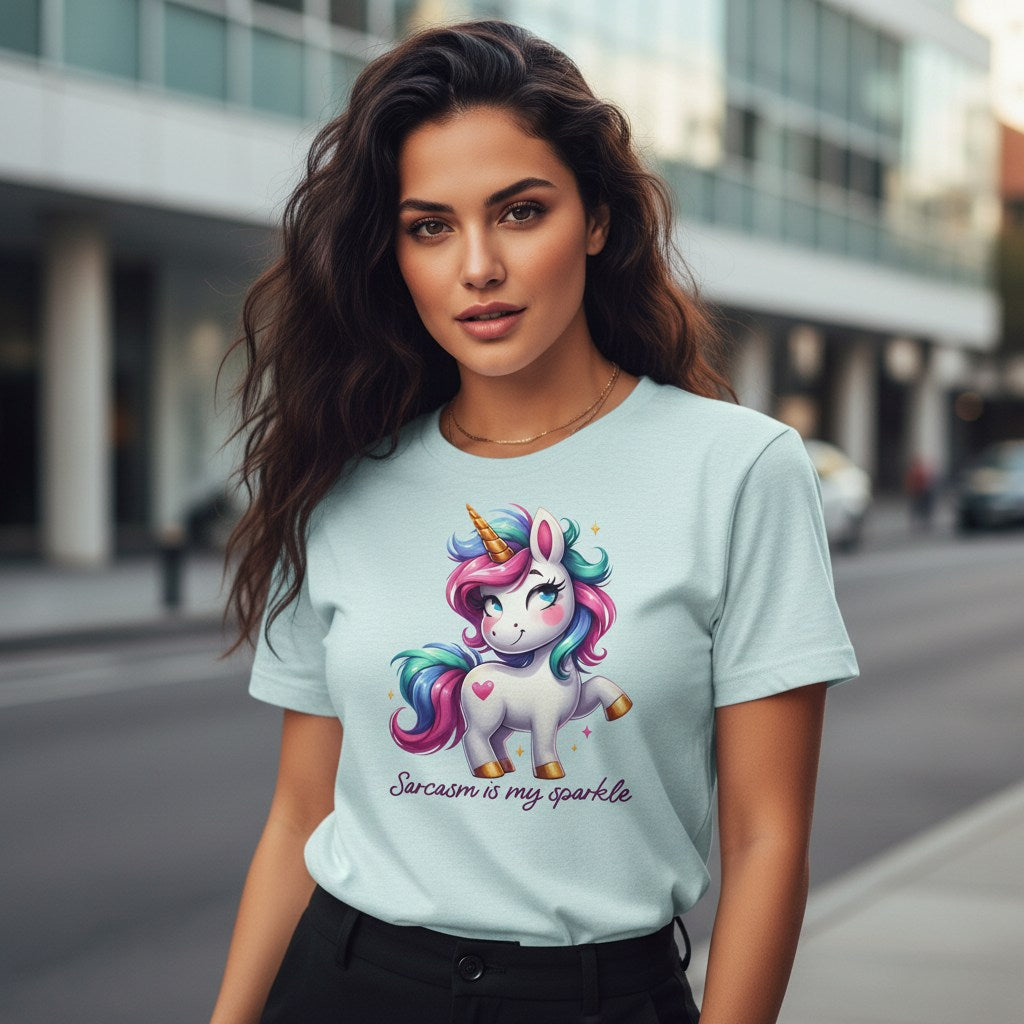 Woman wearing a light blue t-shirt with a unicorn graphic and text on a city street.