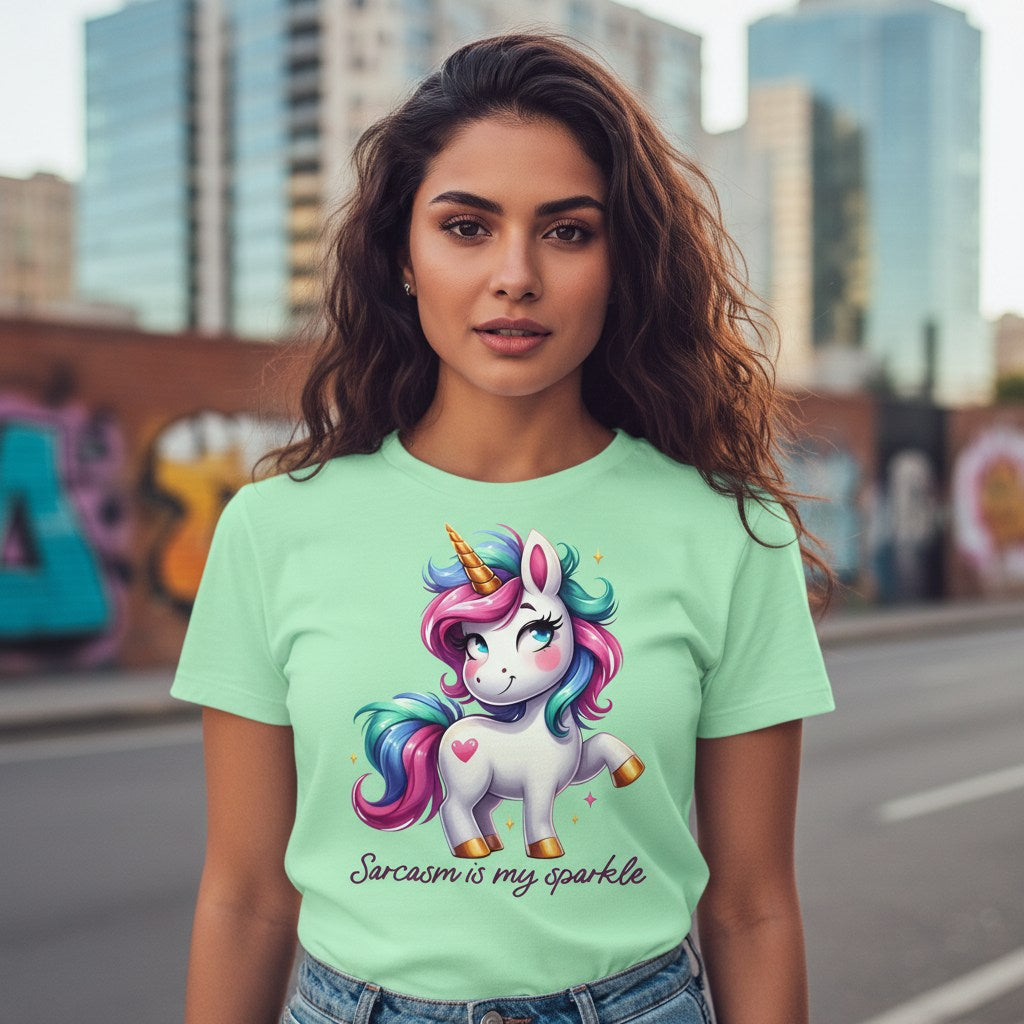 Woman wearing a light green t-shirt with a unicorn graphic and text, standing in an urban setting.