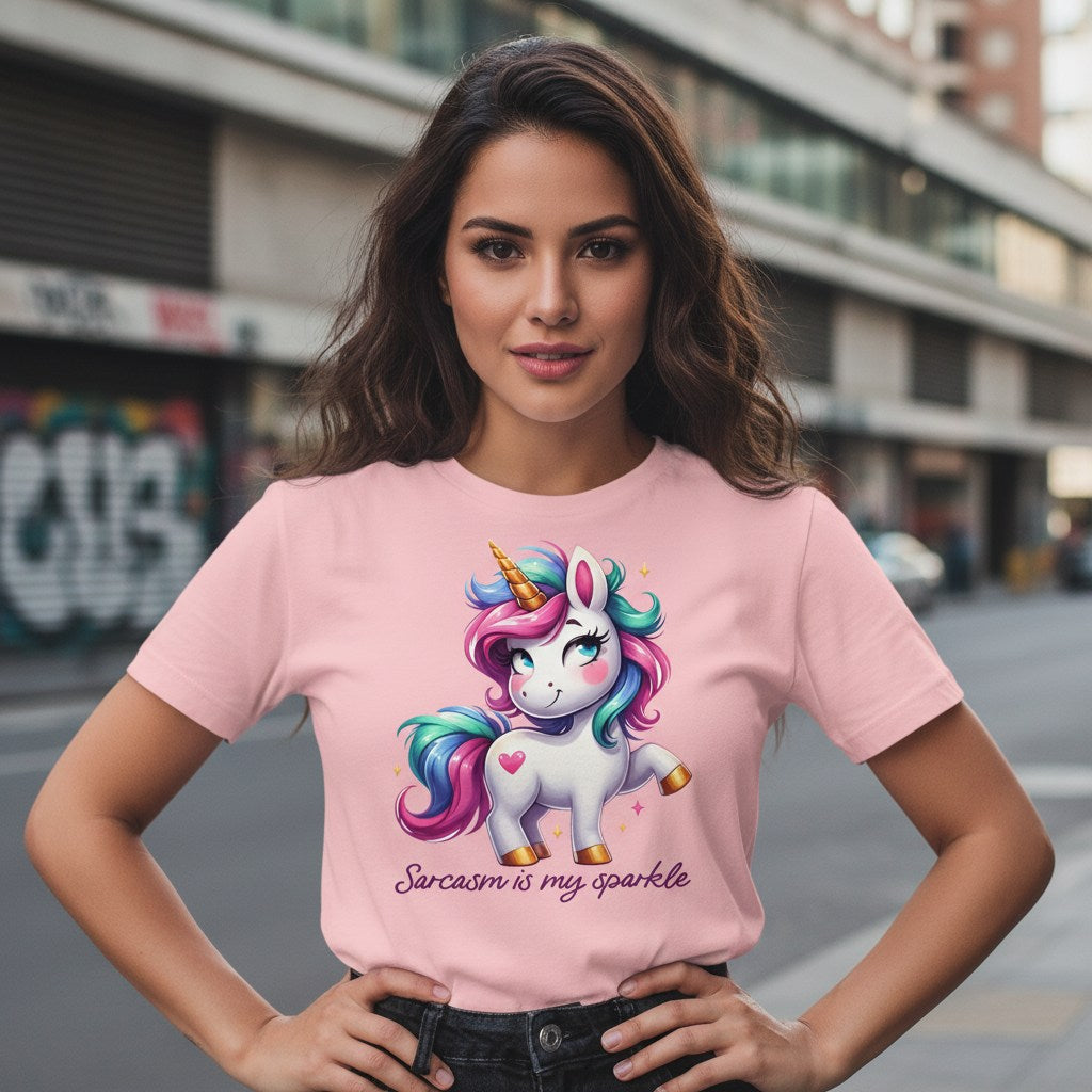 Woman wearing a pink t-shirt with a unicorn graphic and text in an urban setting