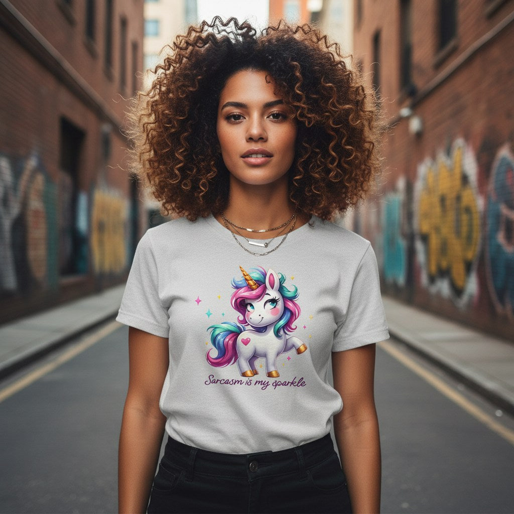 Person wearing a t-shirt with a unicorn design on a street with graffiti.