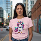 Woman wearing a pink t-shirt with a unicorn design in an urban setting