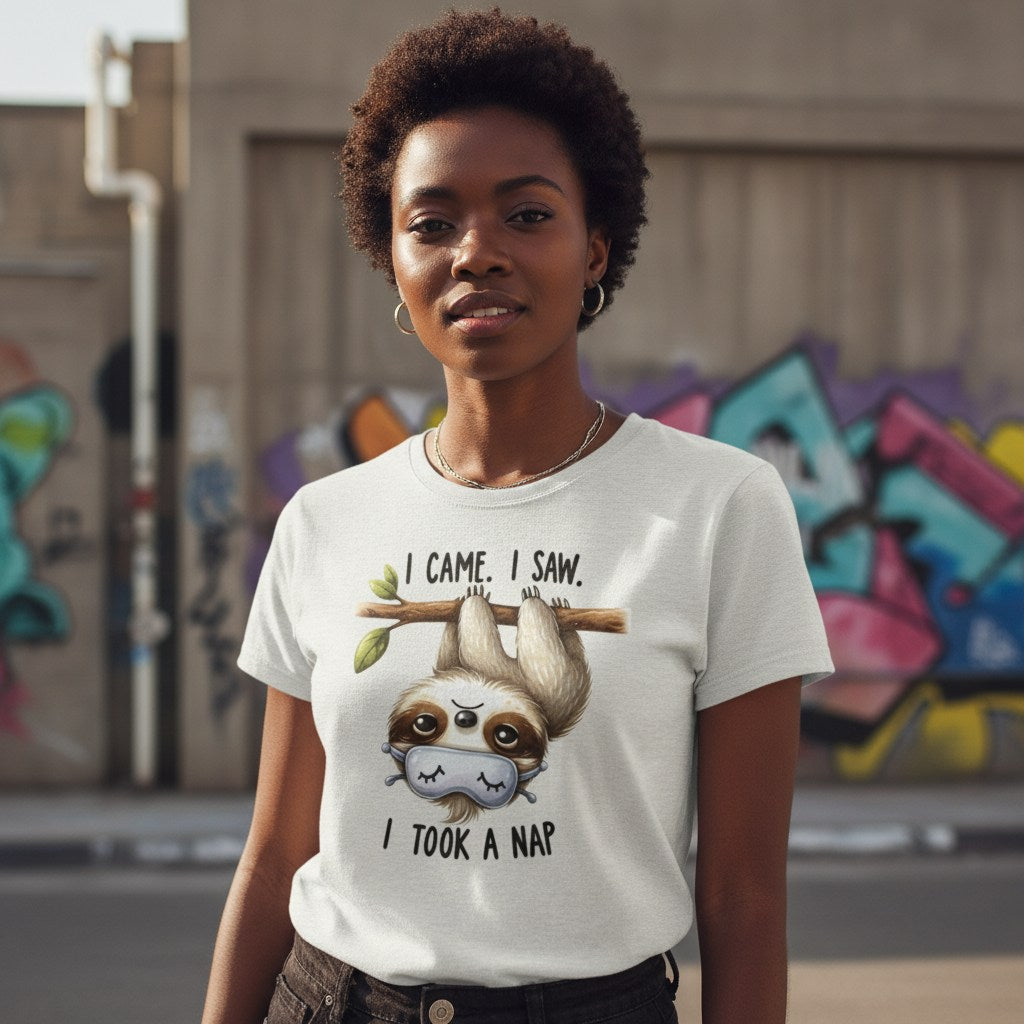 Person wearing a t-shirt with a sloth graphic and text in an urban setting with graffiti.