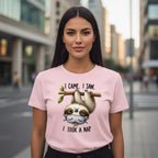 Woman wearing a pink t-shirt with a sloth graphic and text in an urban setting