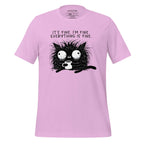 Pink t-shirt with a black cat graphic and text on a wooden surface, featuring the brand 'StayClothed'.