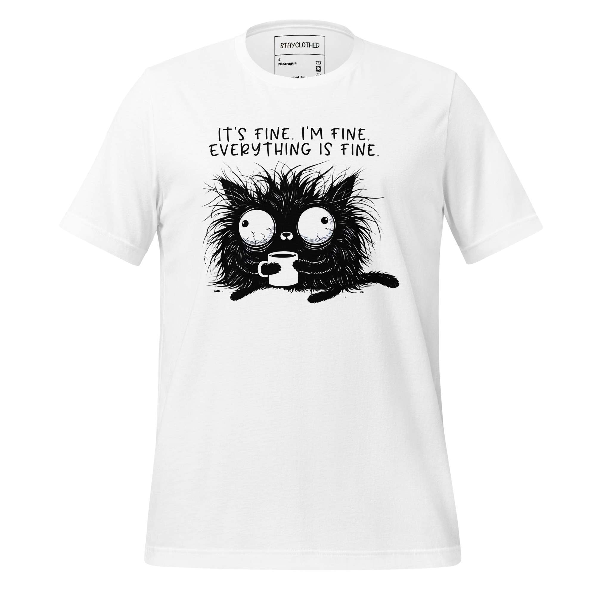 White t-shirt with black cat graphic and text on a wooden surface, featuring 'StayClothed' brand.