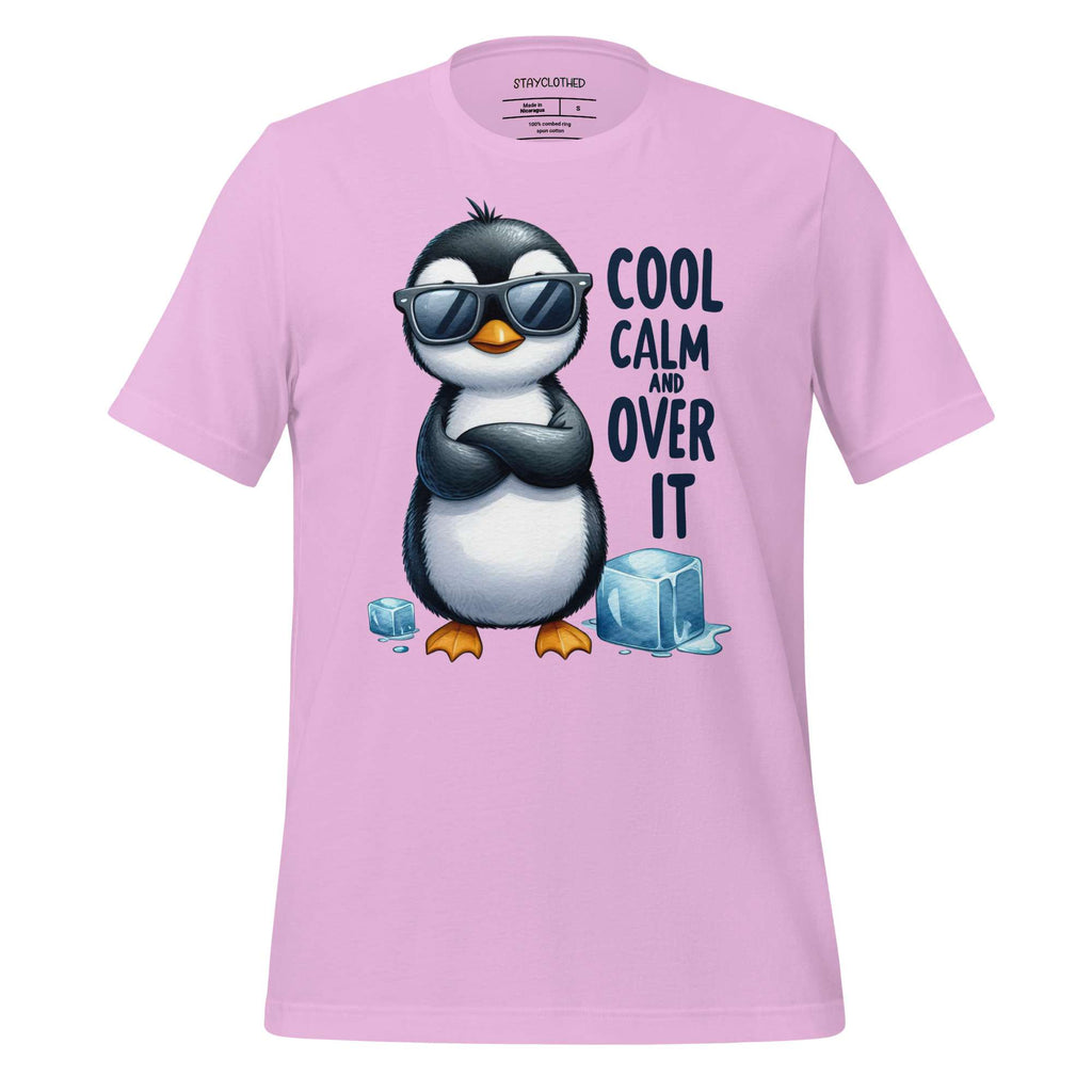Pink t-shirt with a penguin graphic and text on a wooden surface, featuring the brand 'StayClothed'.