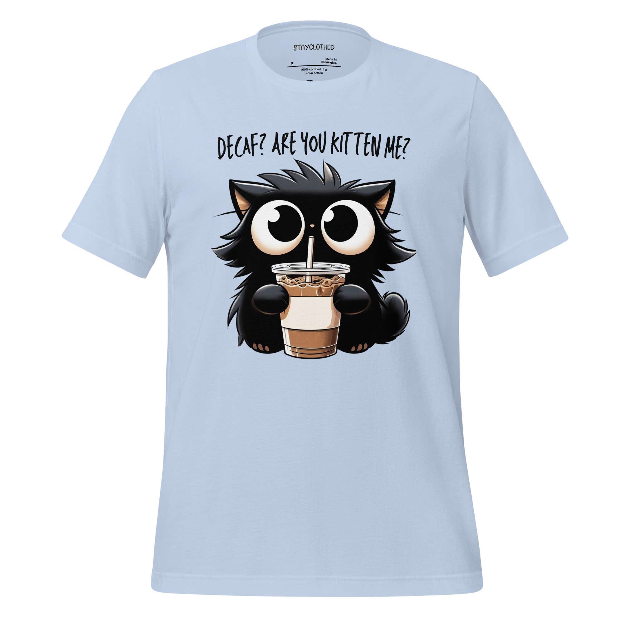 White t-shirt with a cartoon cat drinking coffee on a wooden surface, featuring the brand 'StayClothed'.